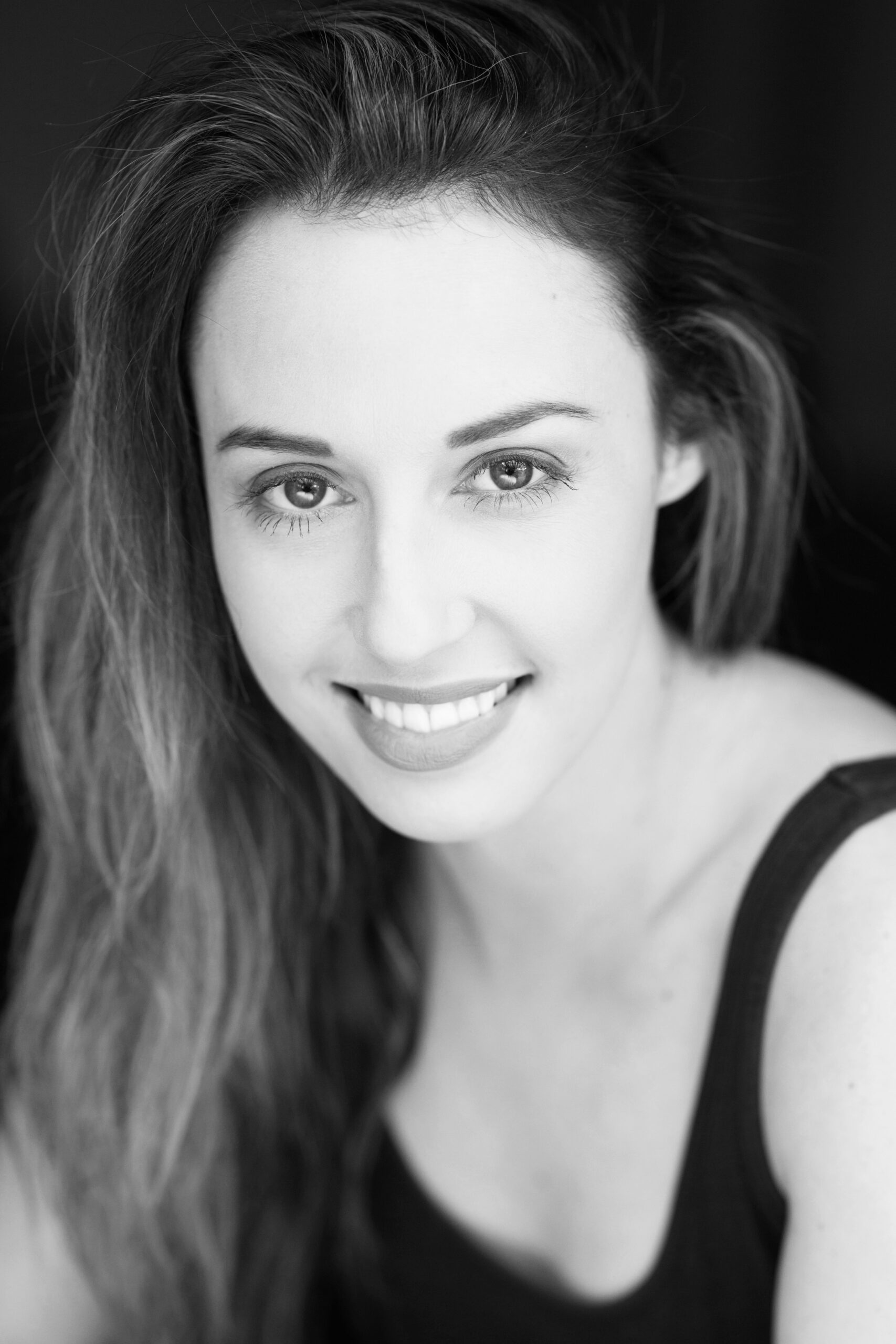 A photo of Sarah Hart, Extras Casting Director, looking at the camera and smiling.